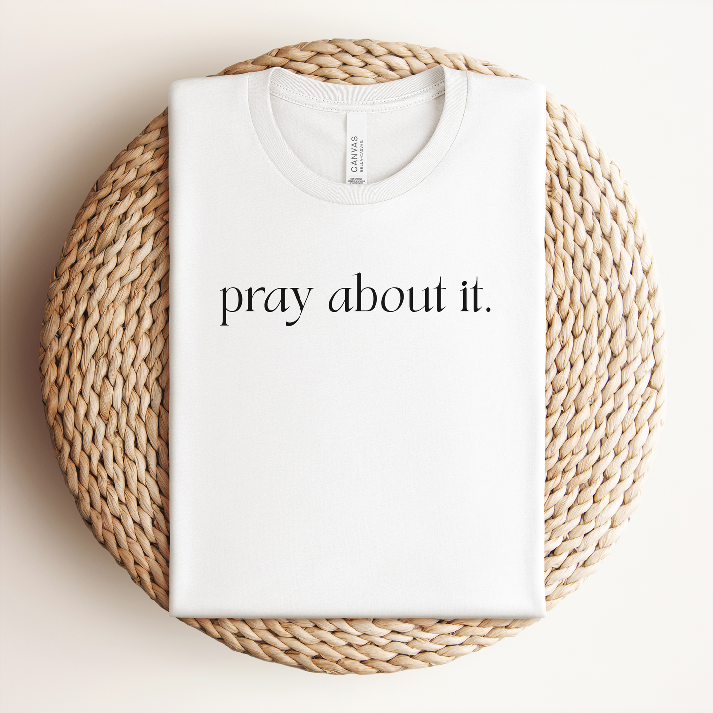 Christian T-shirt in white with text that read "pray about it"