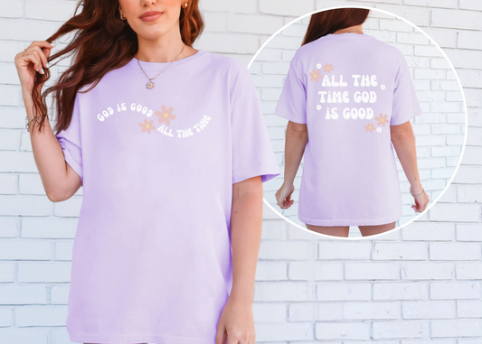 Christian T-shirt with floral accents. Front reads "God is good all the time," and back reads "And all the time God is good."