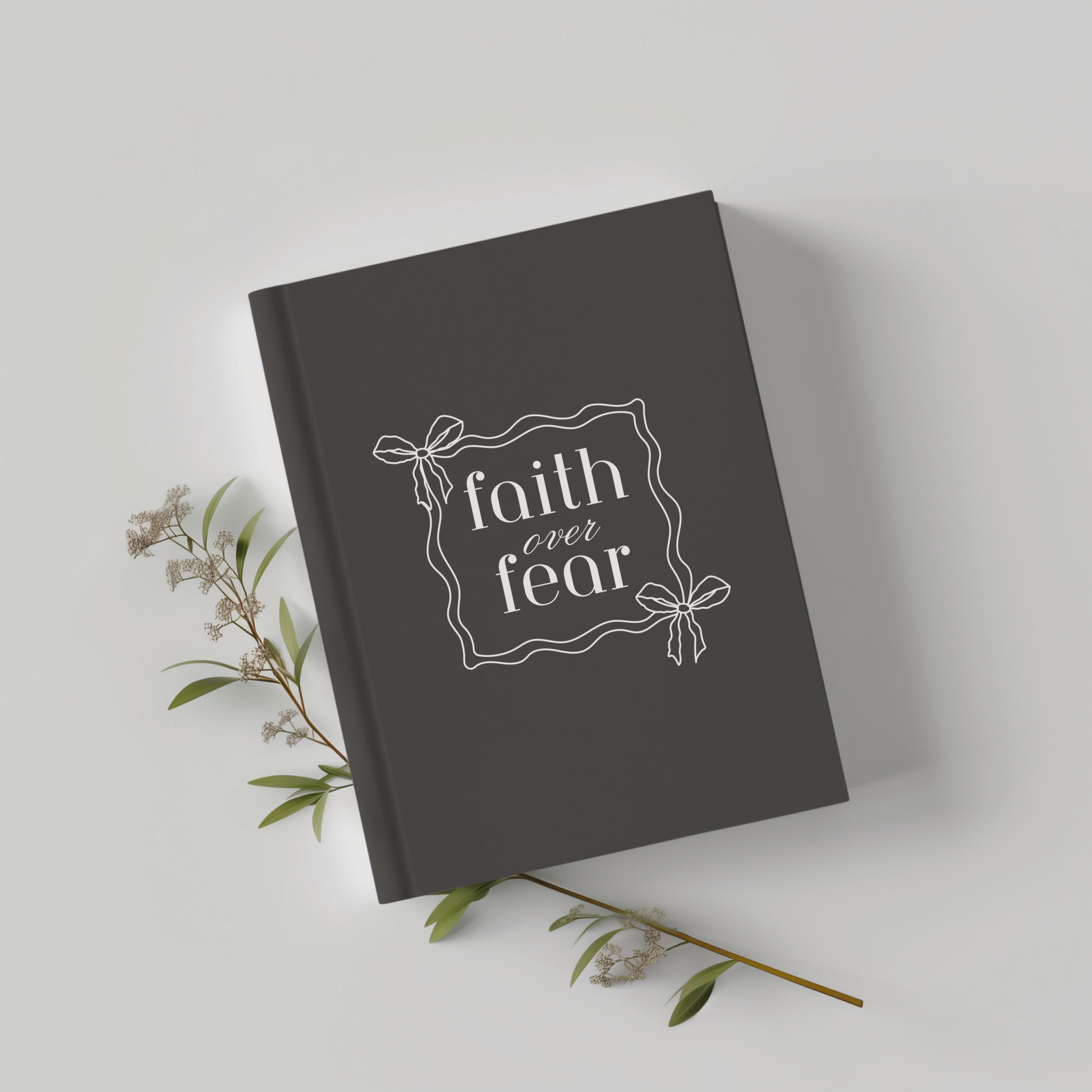 Charcoal Christian Journal with cream text reading "Faith Over Fear," faith-based notebook for prayer and reflection. 