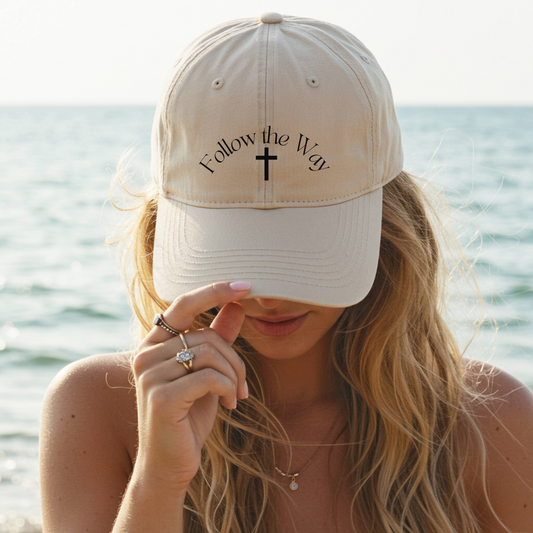 Christian baseball hat with embroidered text reading "Follow the Way". Adjustable faith-based hat in stone color. 