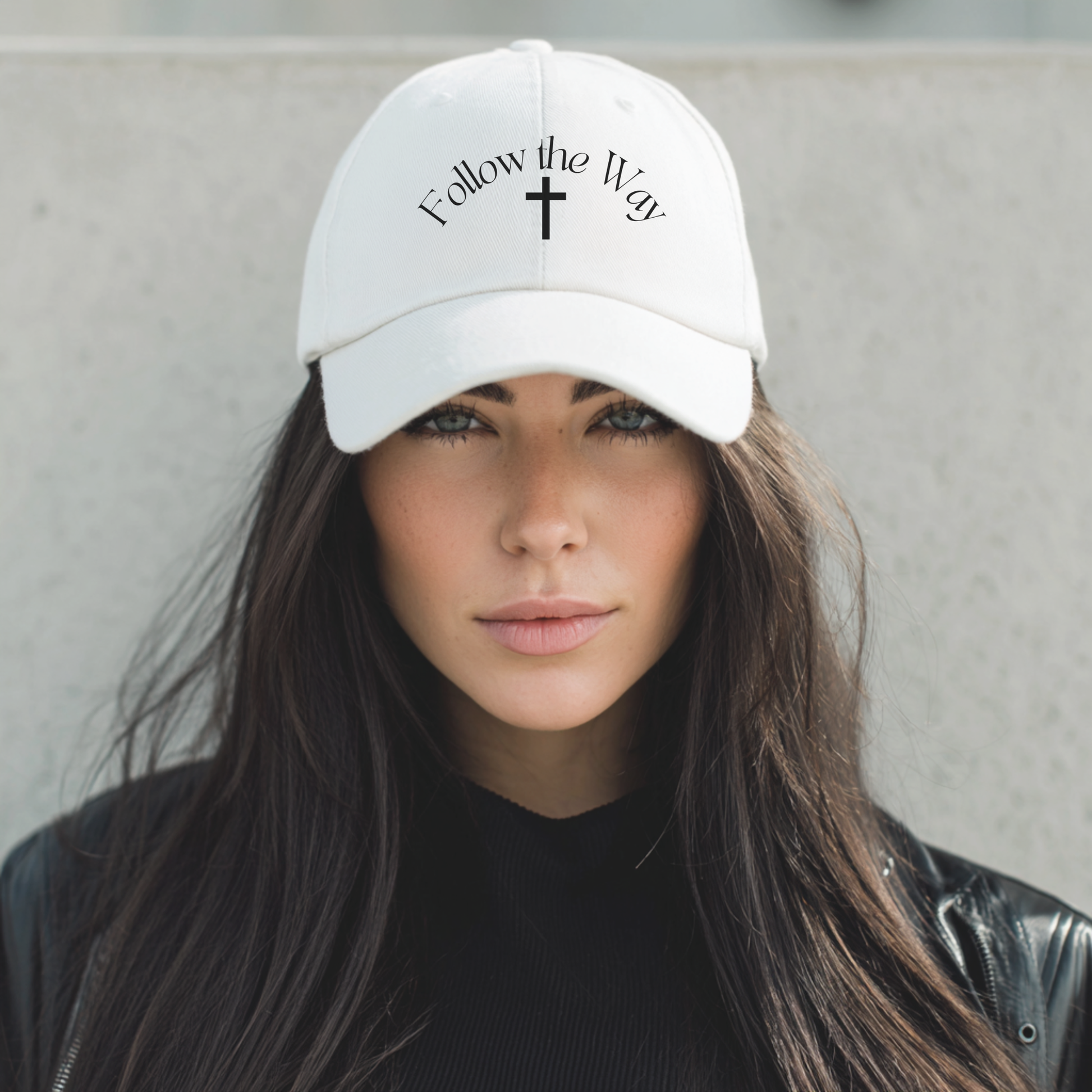 White embroidered Christian baseball hat. "Follow the Way" text in black color with simple cross design. 