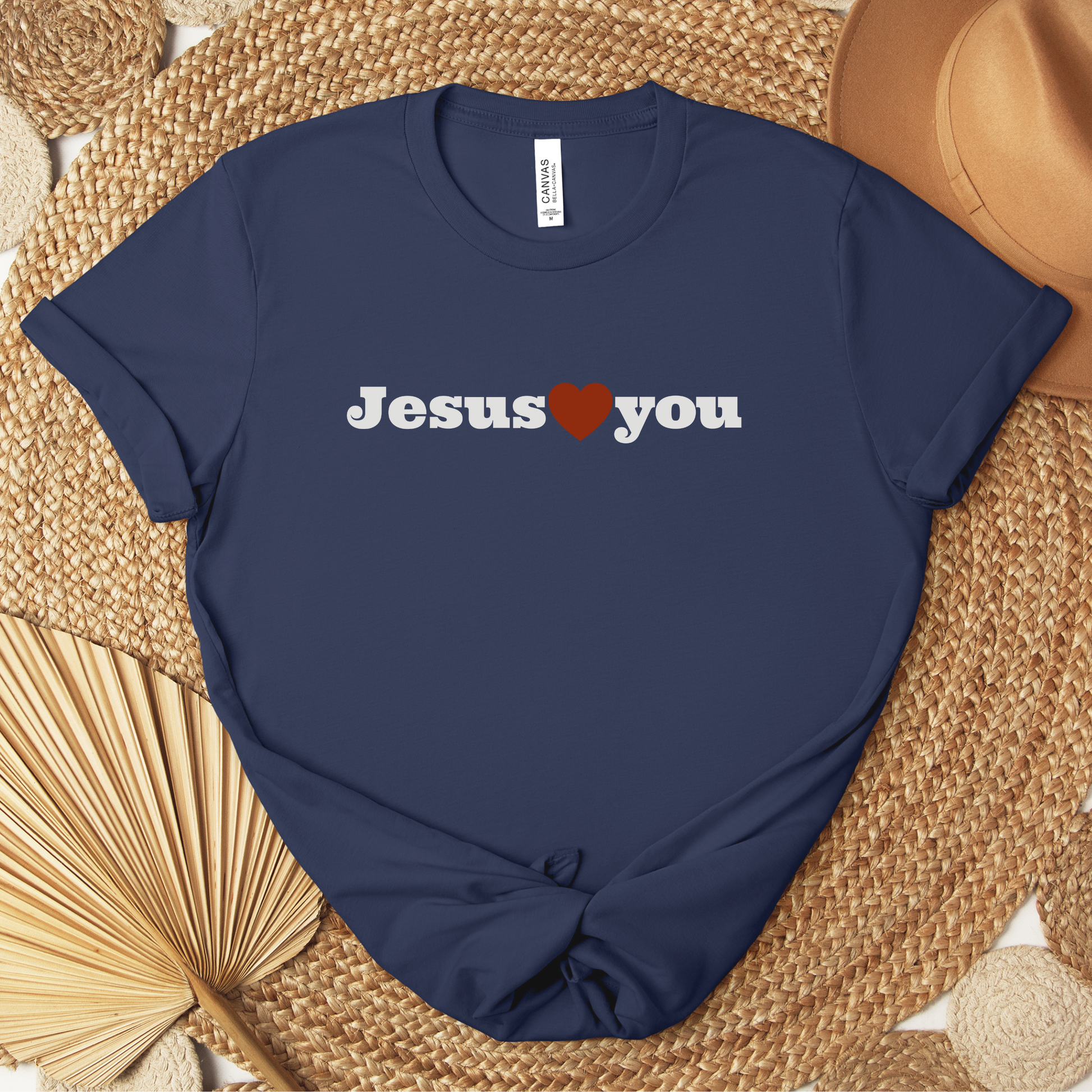 Minimalist Scripture t-shirt reminding viewers that Jesus loves them. 