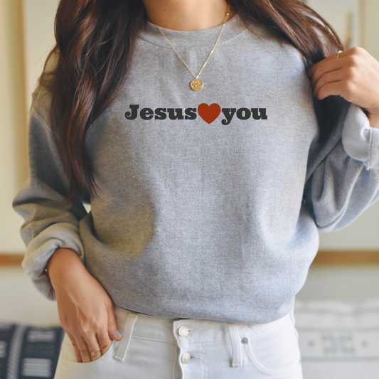 Neutral Christian sweatshirt with simple "Jesus ♥️ You" design inspired by Romans 5:8 and John 3:16.