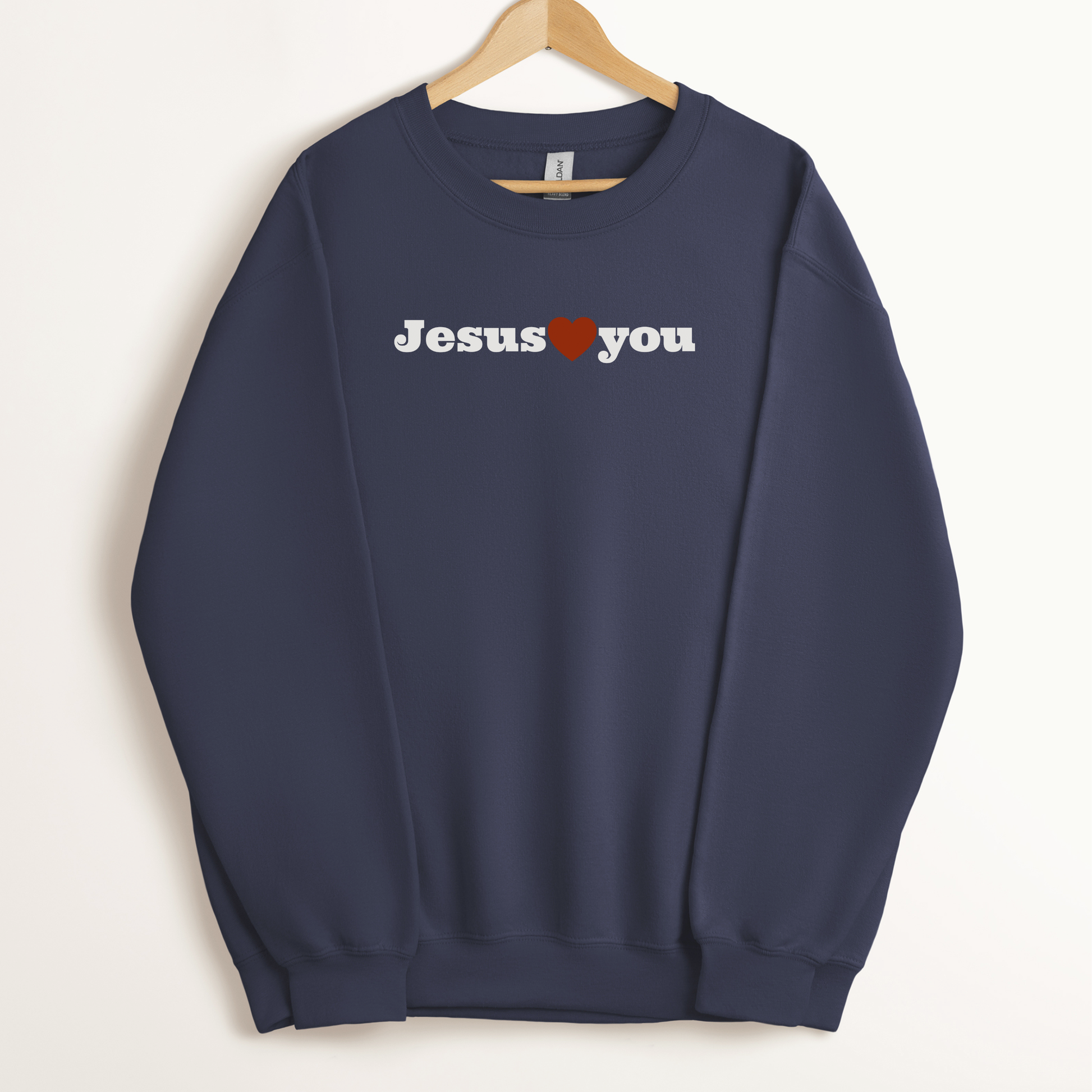 Jesus Loves You Sweatshirt with simple faith based design. Unisex Christian crewneck in navy color. 