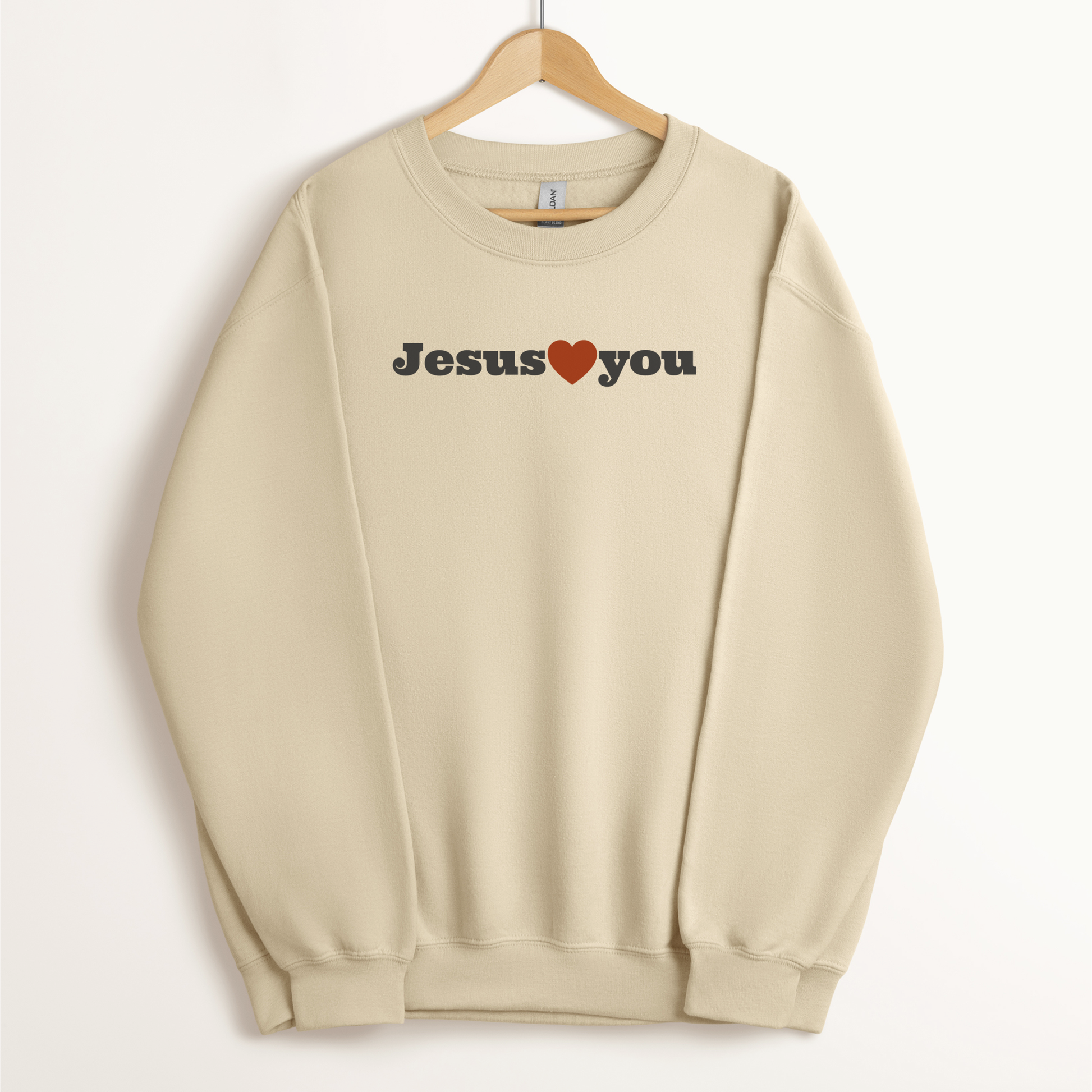 Christian sweatshirt from faith-based clothing company in neutral color that says "Jesus Loves You."