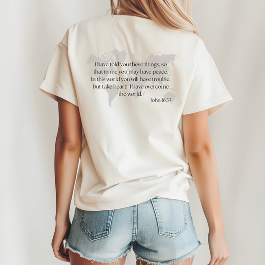 Christian t-shirt in natural color. Bible verse from John 16:33 on back with world map. 
