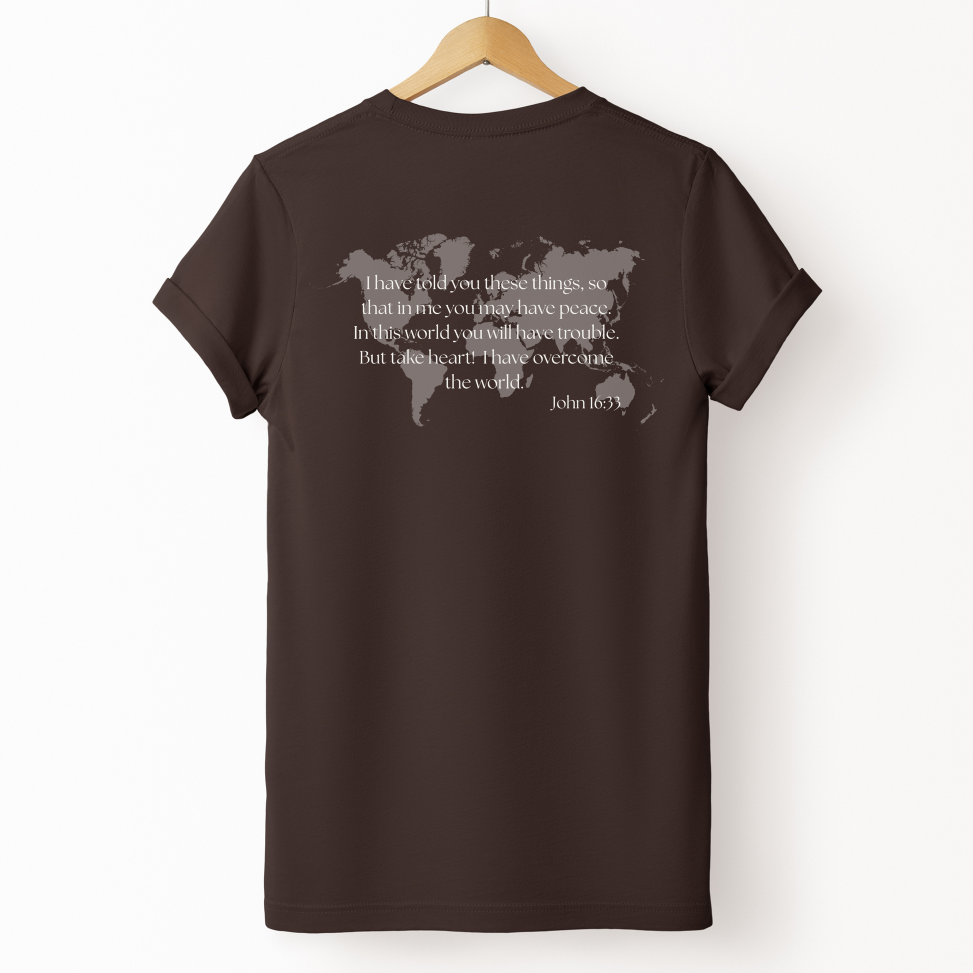 Christian T-shirt with world map graphic and bible verse John 16:33. Faith based apparel inspired by scripture. 