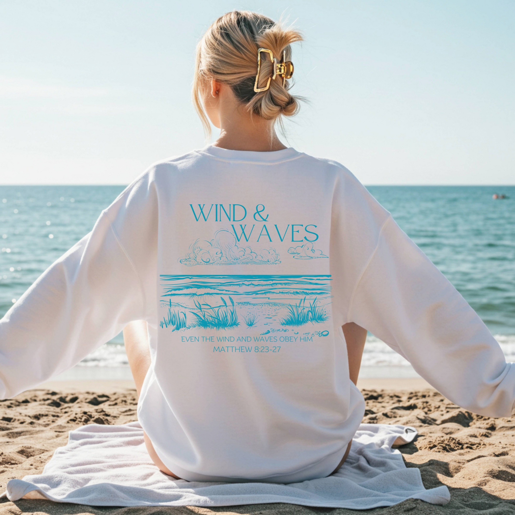 Wind & Waves Christian Sweatshirt with Matthew 8 Bible Verse and beach scene graphic. 